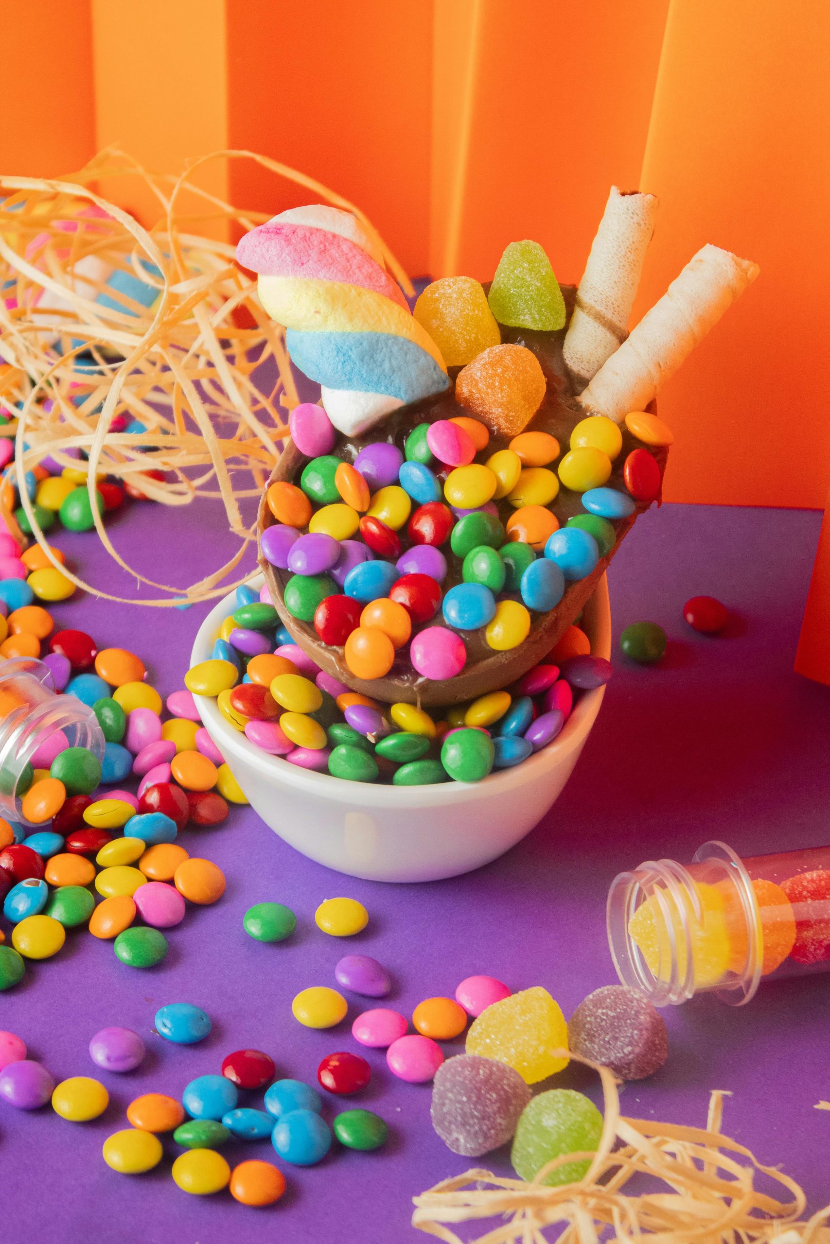A vibrant collection of colorful candies and sweets in a playful arrangement, perfect for food photography.